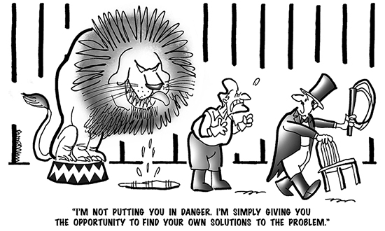 B&W cartoon showing a circus ringmaster taking away a lion tamer's chair and whip and telling him he's being given an opportunity to discover new ways of solving problems