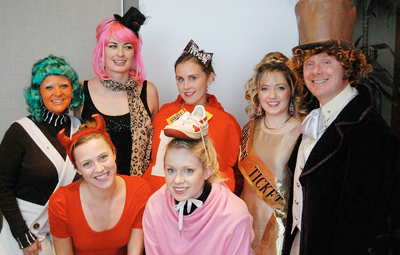 Employees at Rusty George Creative all wearing funny costumes for Halloween