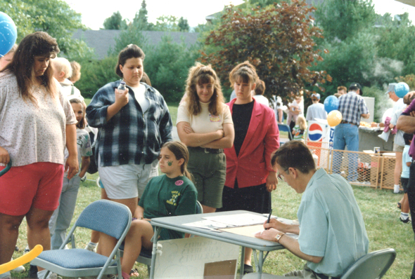 Mark Armstrong drawing caricatures at Cedarcrest Foundation 50th birthday party in Keene NH 1997