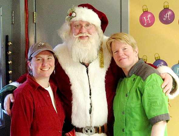 Deidre Pope Robyn Dochterman co-owners St. Croix Chocolate Company with jolly old Santa Claus