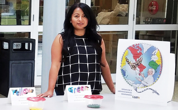 Maryknoll Magazine photo program coordinator Missionary Childhood Association Los Angeles archdiocese exhibit using Pope Francis dove campaign poster