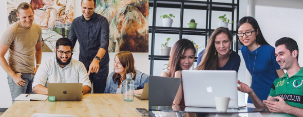 Happy people standing sitting around laptop computer pointing looking at screen