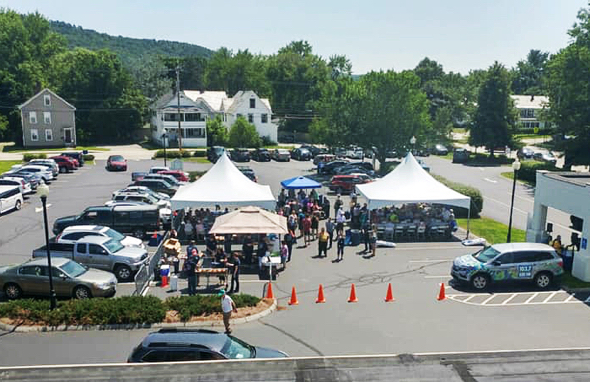 Bird's-eye view photo of Savings Bank of Walpole Marlboro Street parking lot in Keene, Nh, on Customer Appreciation Day with tents set up for hot dog cookout